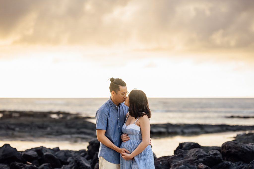 couple kissing during sunset in Kona, Hawaii