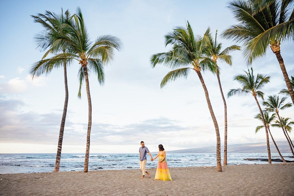 couple holding hands at a beach in Kona, Hawaii