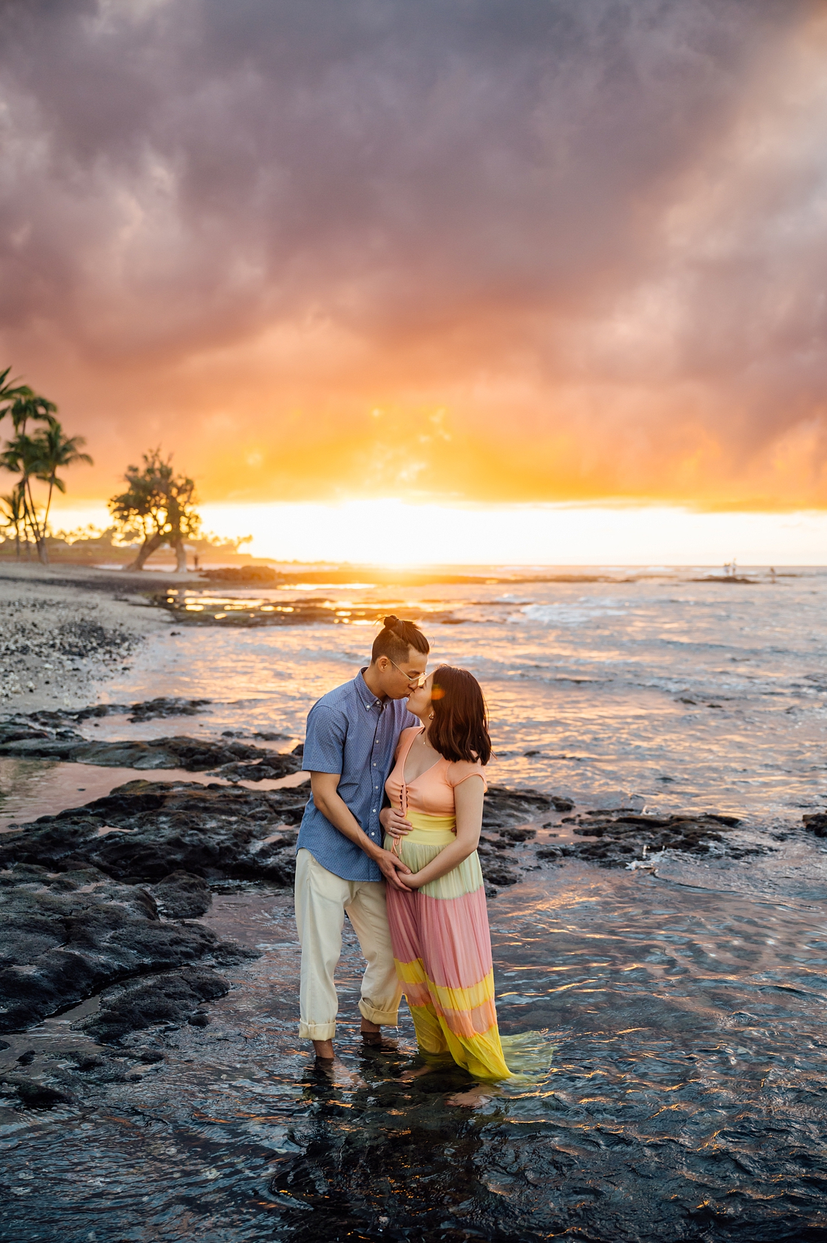 couple kissing at the beach by Kona Hawaii photographer