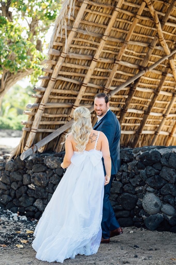 bride and groom's first look at Mauna Lani