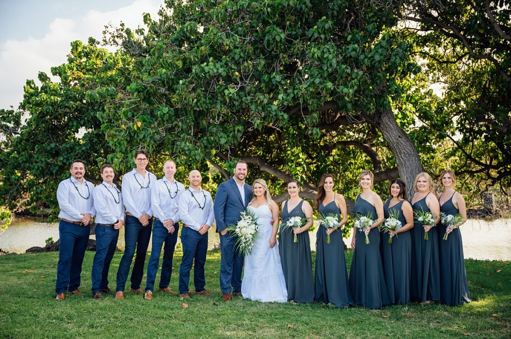 bride and groom with their wedding party during their Big Island wedding