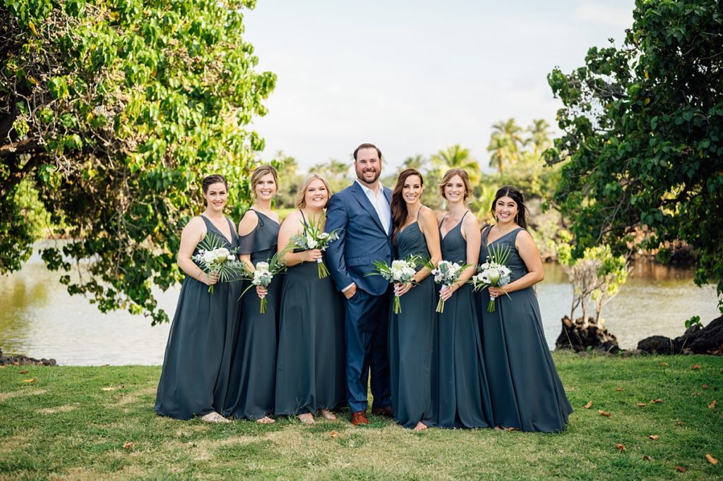 groom with the bridesmaids during his Big Island wedding