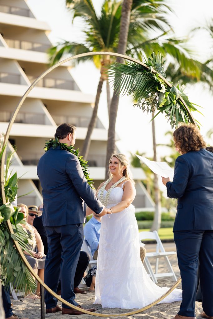 bride and groom holding hands during their Big Island wedding ceremony