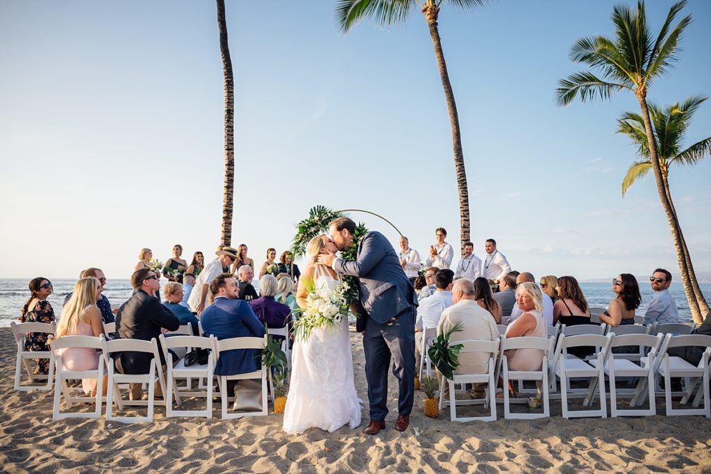 bride and groom kiss after their Big Island wedding ceremony