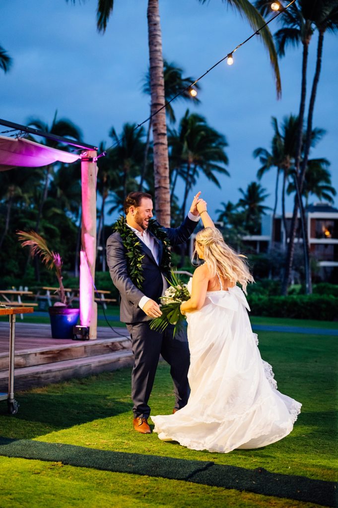 bride and groom dancing happily during their Mauna Lani wedding