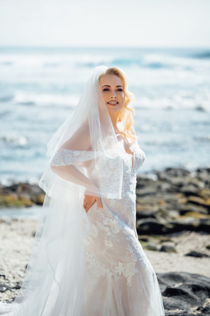 stunning bride at the beach by wedding photographer in Hawaii