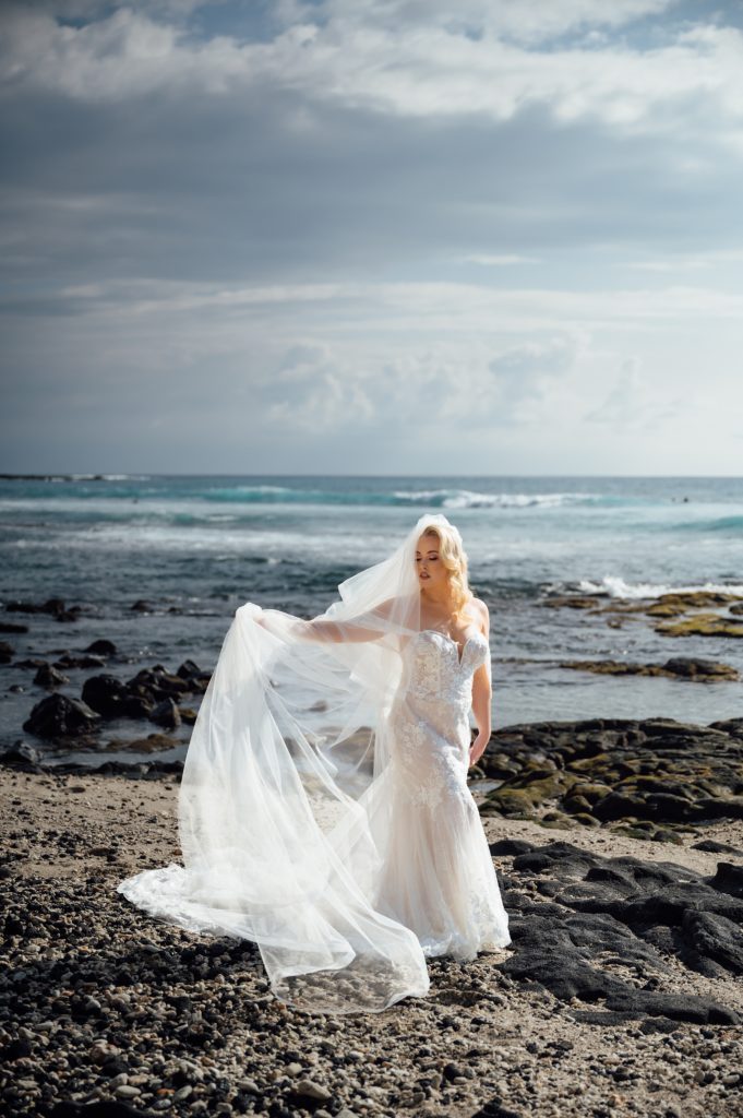 gorgeous bride with her long veil by Hawaii wedding photographer