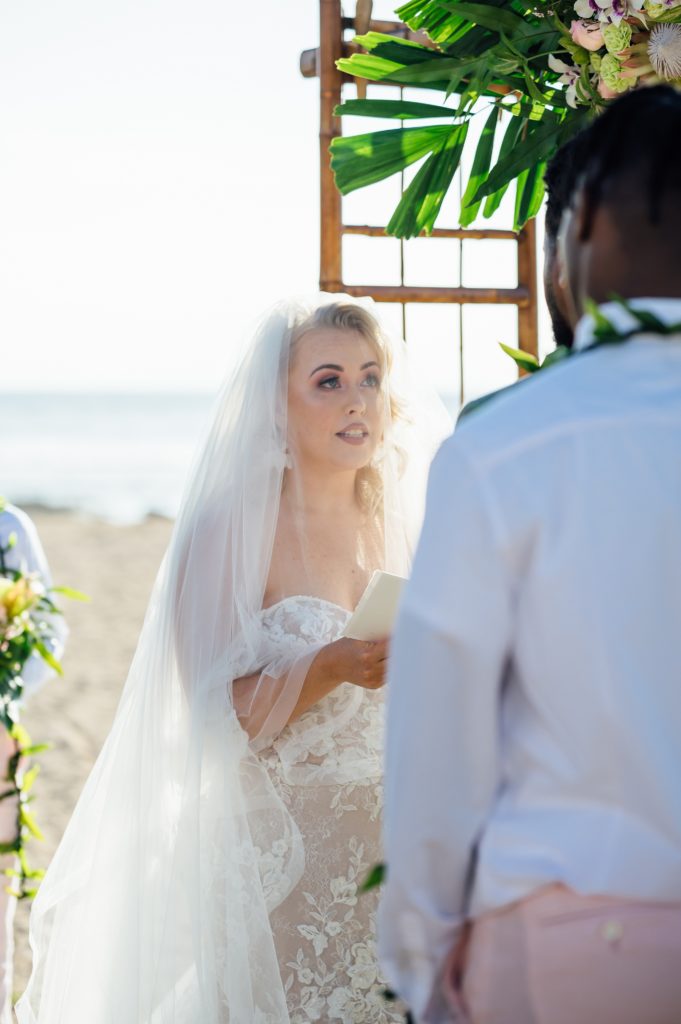 bride reading her vows during her Hawaii wedding ceremony