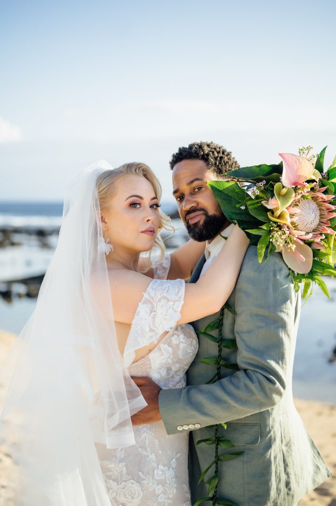 beautiful newlyweds portrait by wedding photographer in Hawaii beach