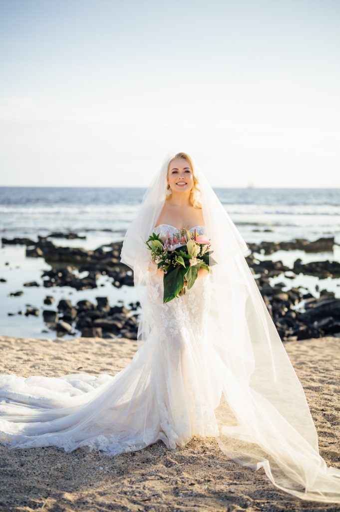 radiant bride by wedding photographer on Hawaii beach