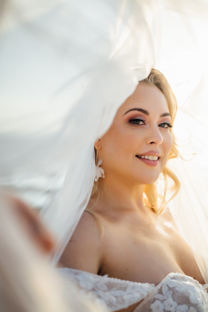 gorgeous bride under her veil by wedding photographer in Hawaii