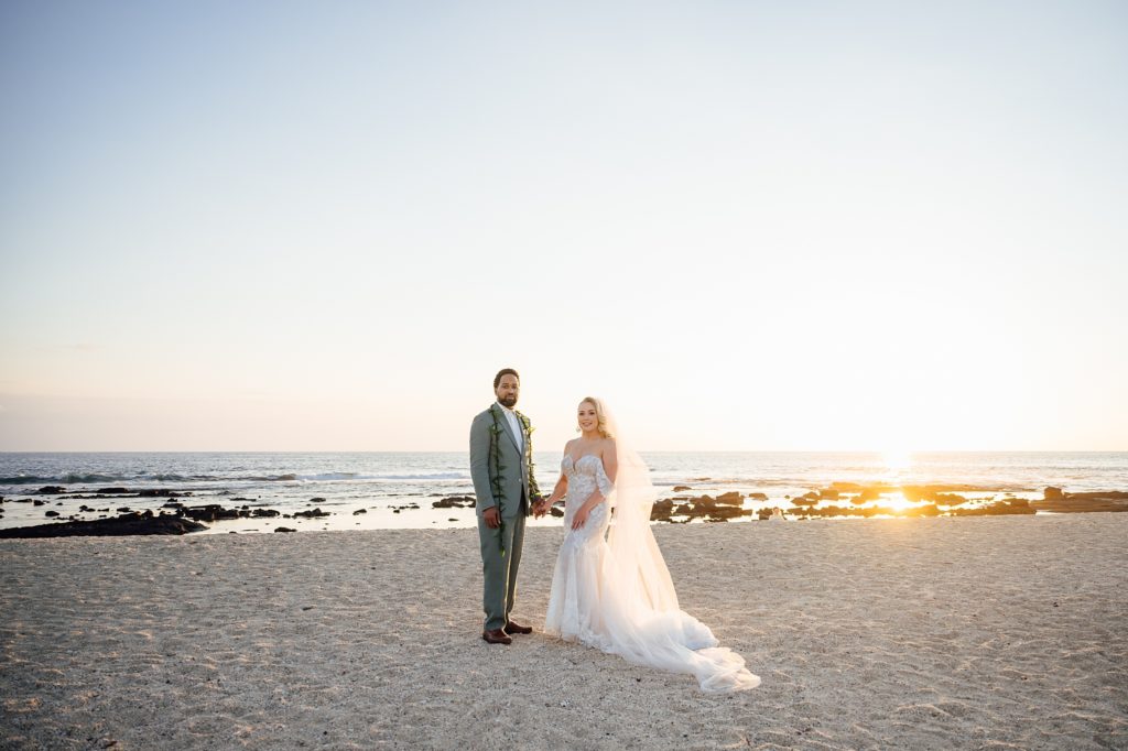 beautiful beach sunset with the newlyweds at by Hawaii photographer