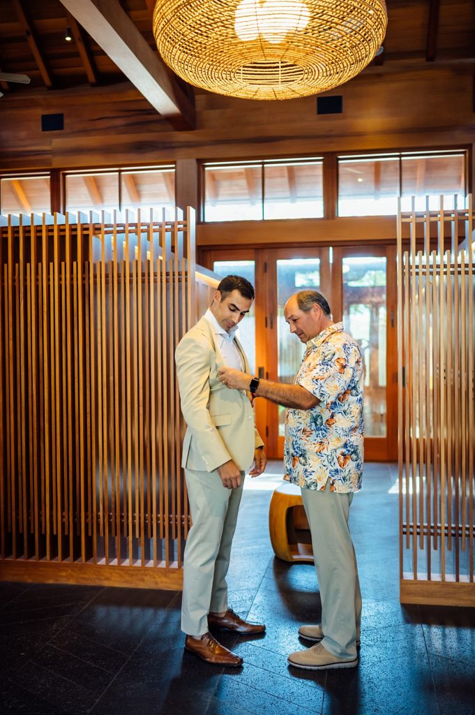 groom getting ready with his father at the hotel