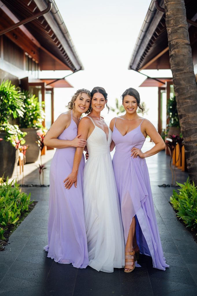 bride with bridesmaids by Big Island wedding photographer
