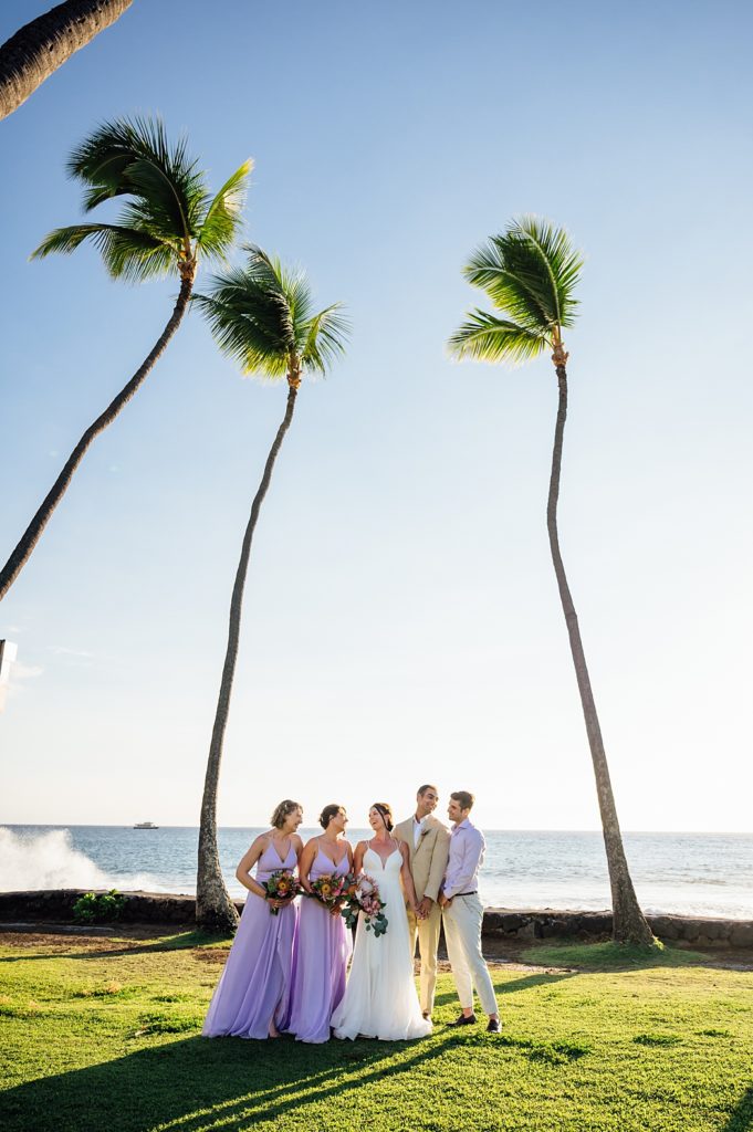 newlyweds with their wedding party at Big Island beach