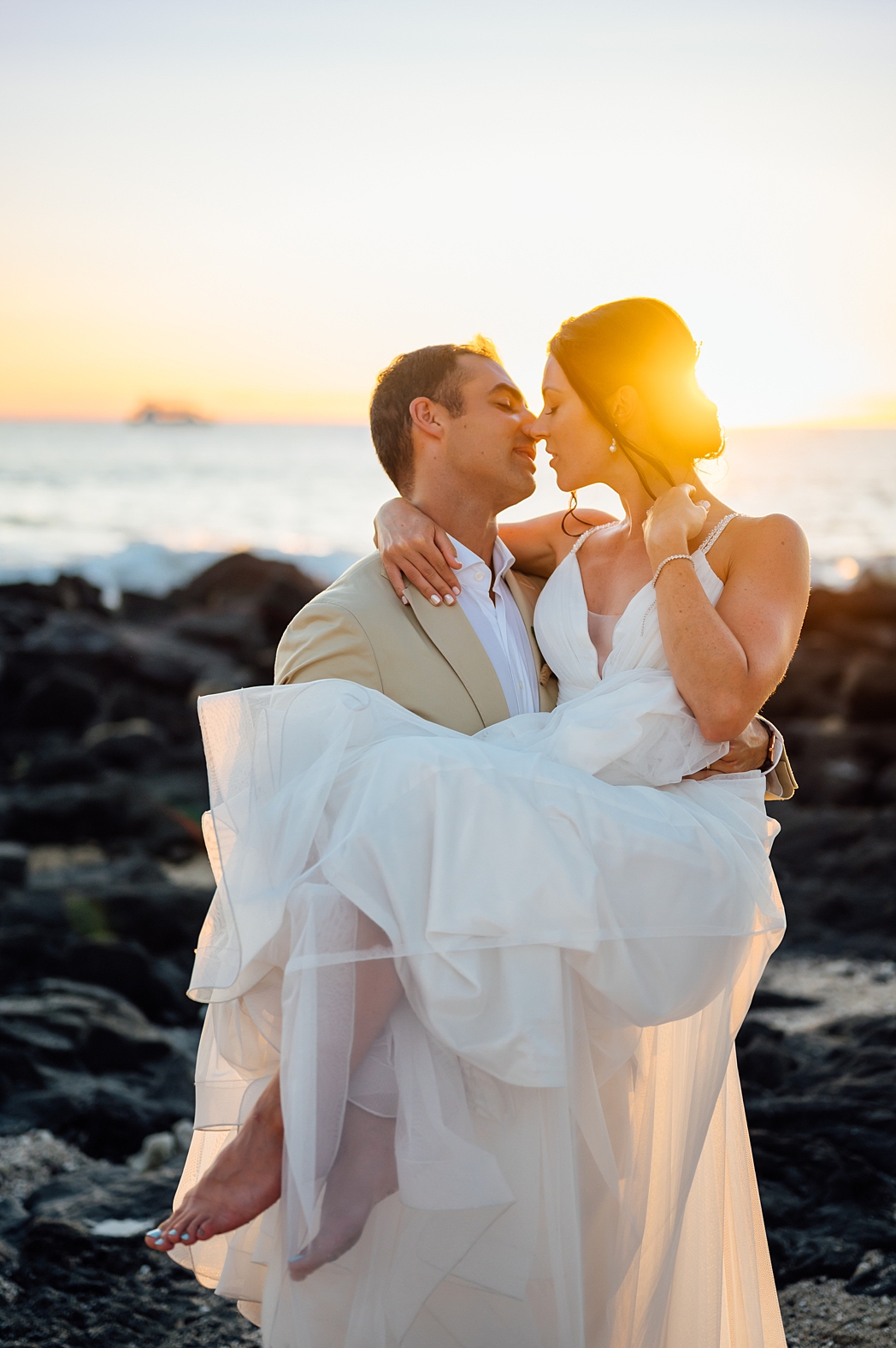 sweet photo of the bride and groom by the Big Island beach