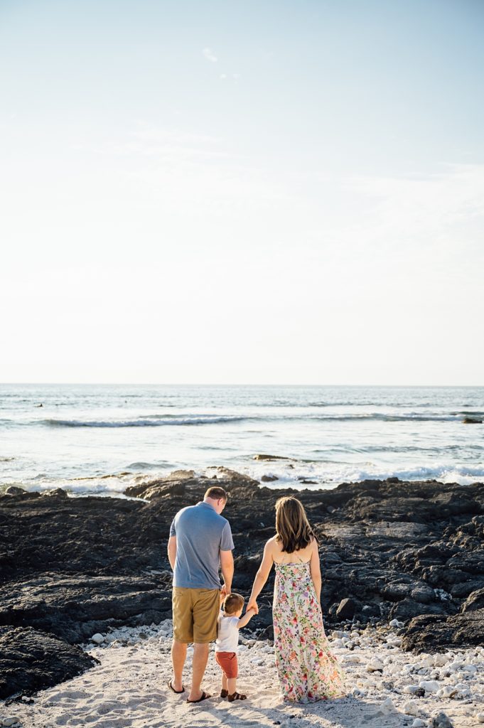 family holding hands on a Big Island beach