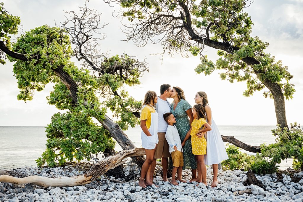family's sweet moments under the trees at Big Island beach