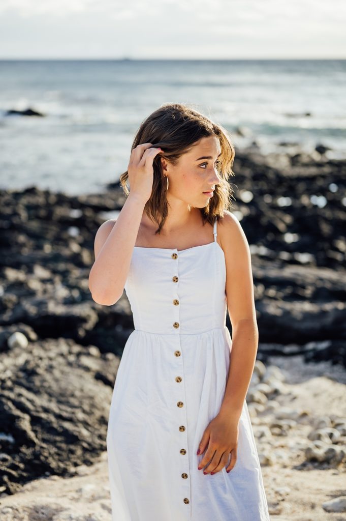 beautiful young lady in white during their Hawaii beach vacation