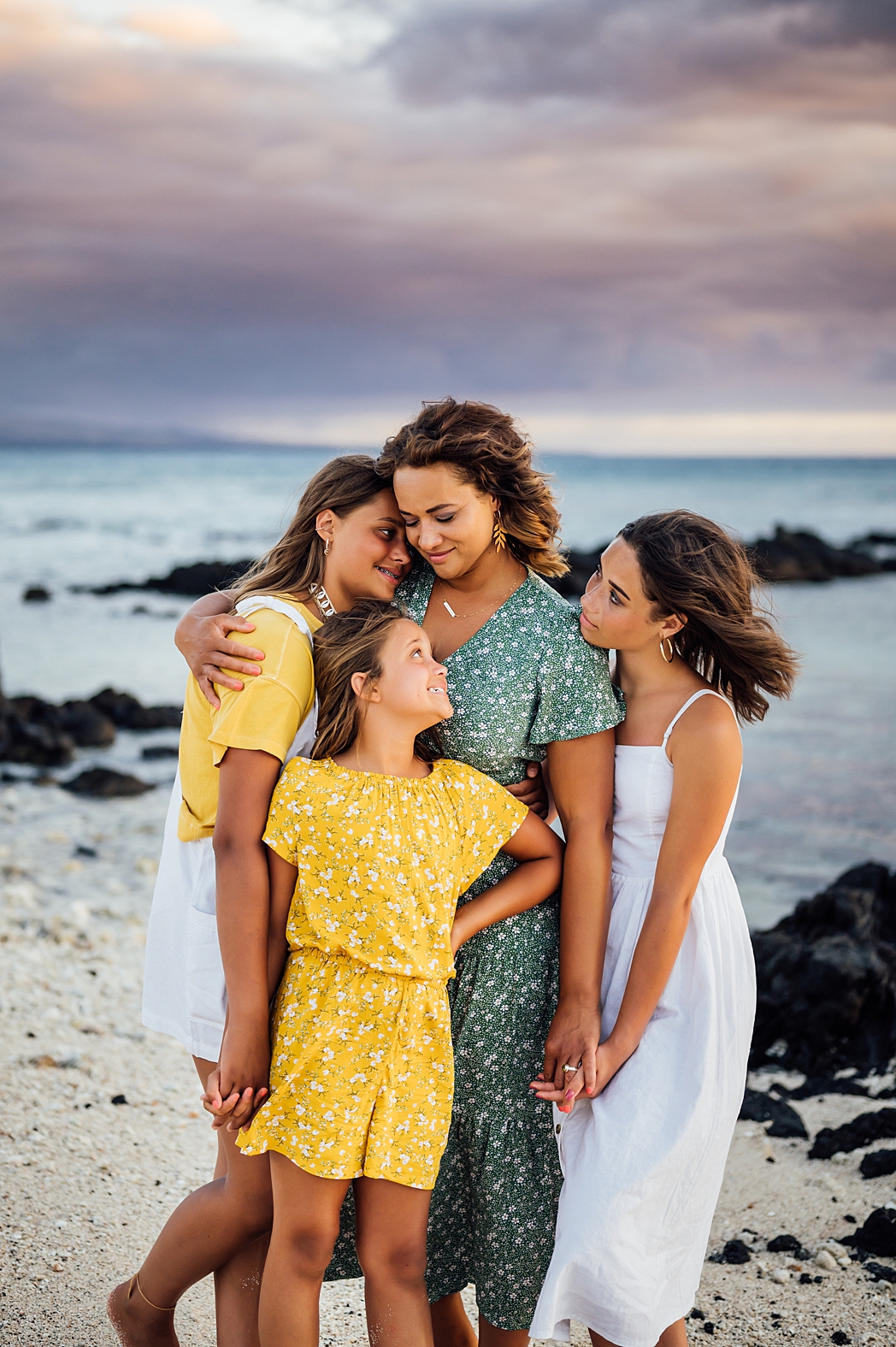 precious moments of mom and her daughters at a beach during their vacation