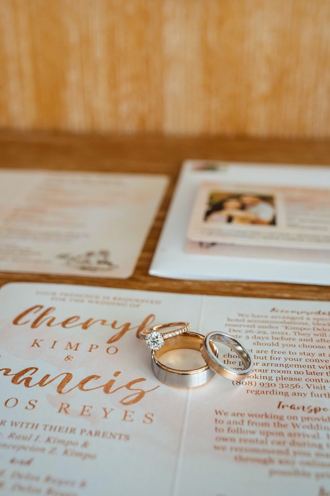the rings and invitation during a Big Island wedding