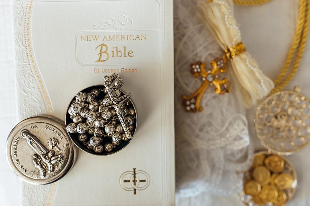 Holy Bible, rosary, coins, cord, and veil 