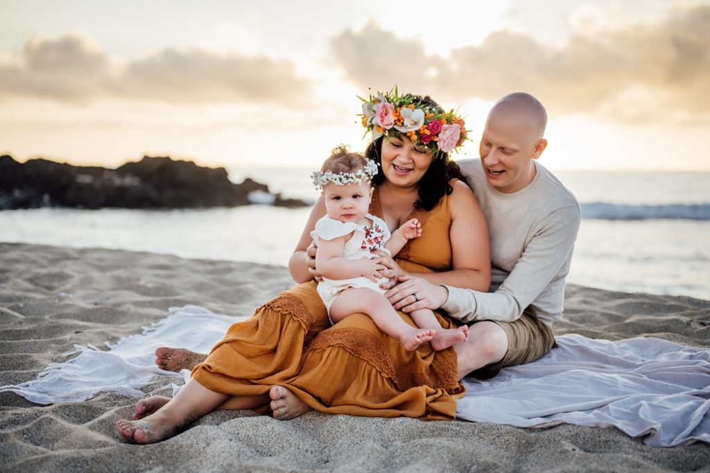 precious family photo in Hawaii on the beach sand 