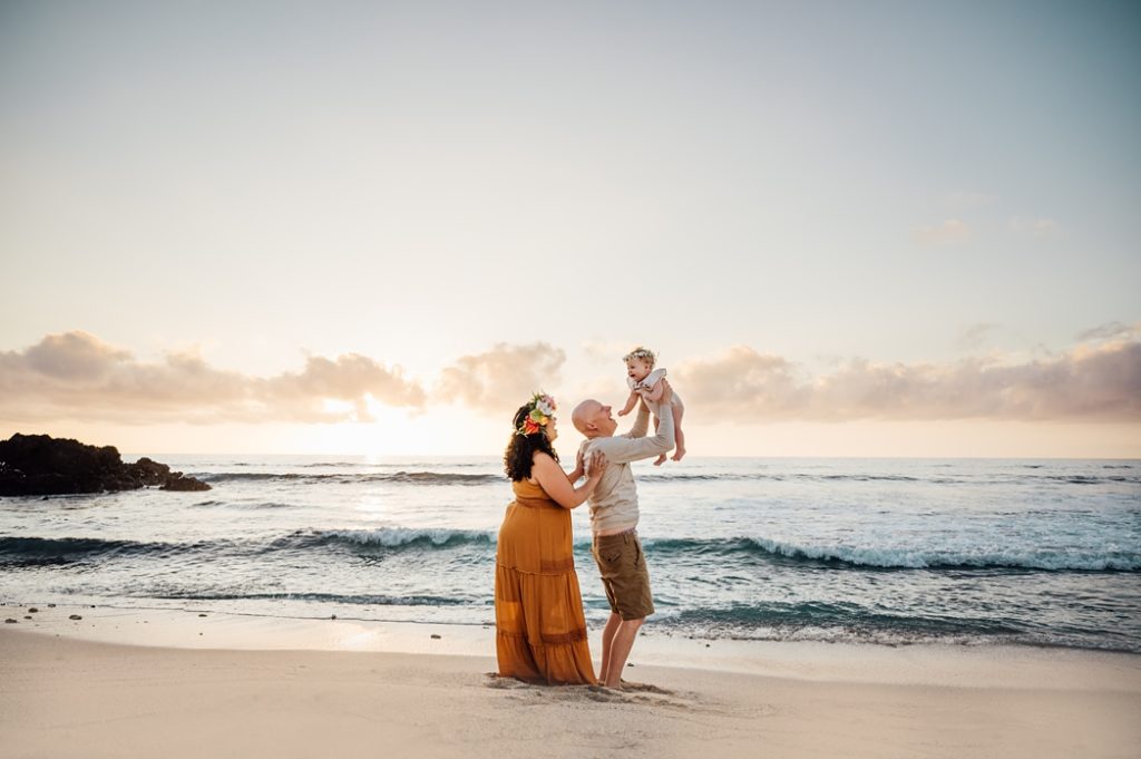 happy family photo playing on Hawaii beach