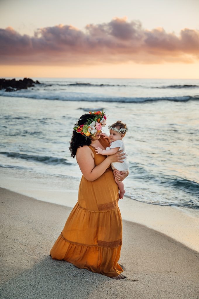 photo of mom and baby enjoying at the beach