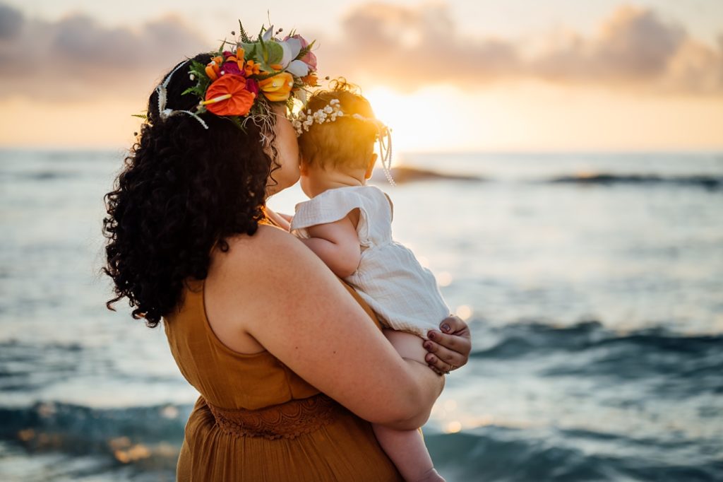 sweet photo of mom and baby under the Hawaii golden sunset