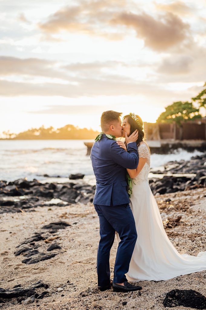 bride and groom kissing during their beach wedding