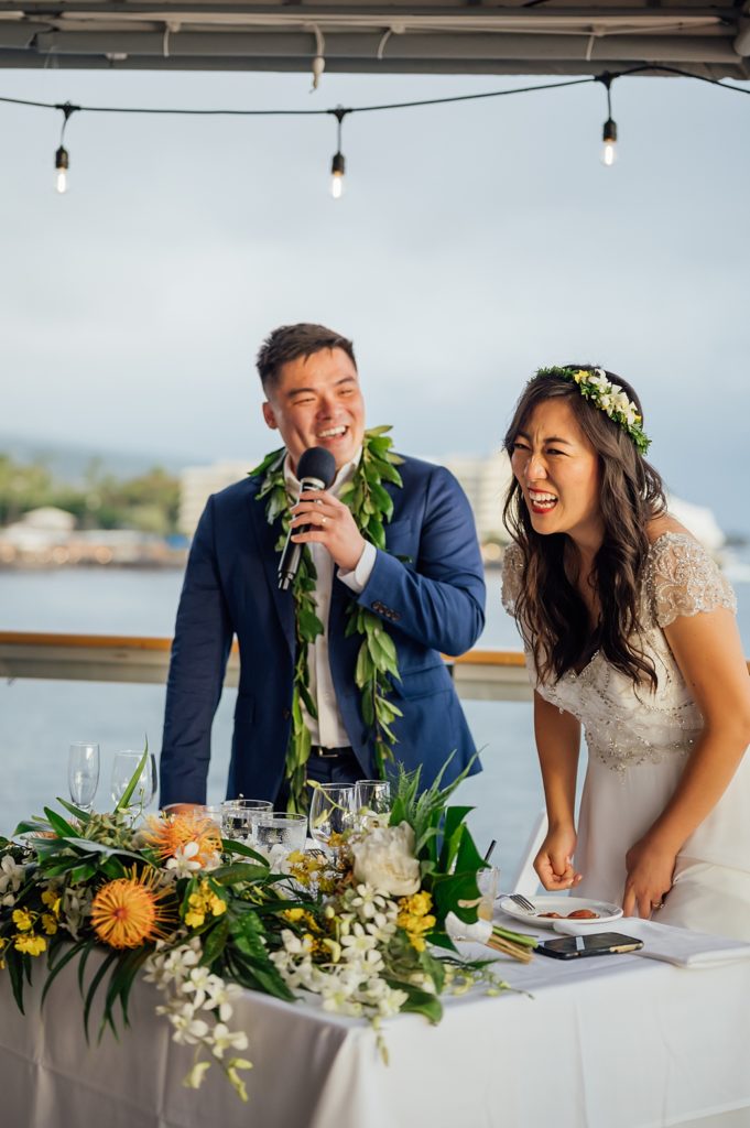 couple happily giving their speech during their Hawaii wedding reception