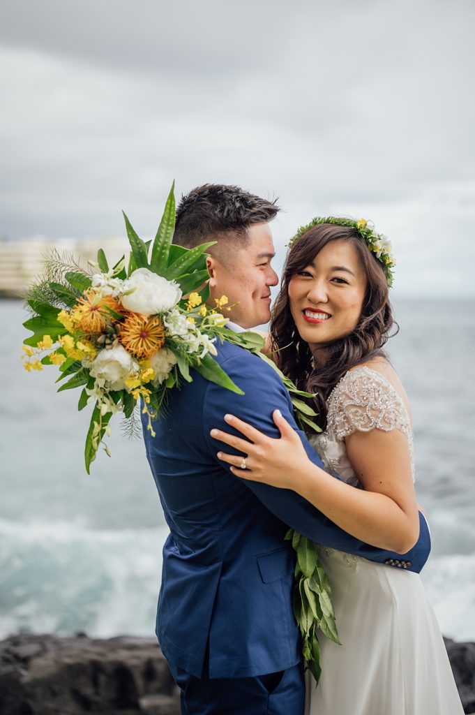 sweet moments of bride and groom at Hawaii beach