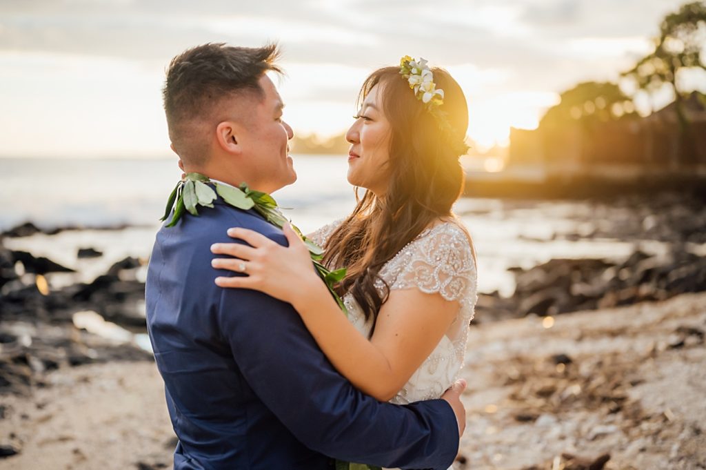 bride and groom looking adoringly at each other during sunset