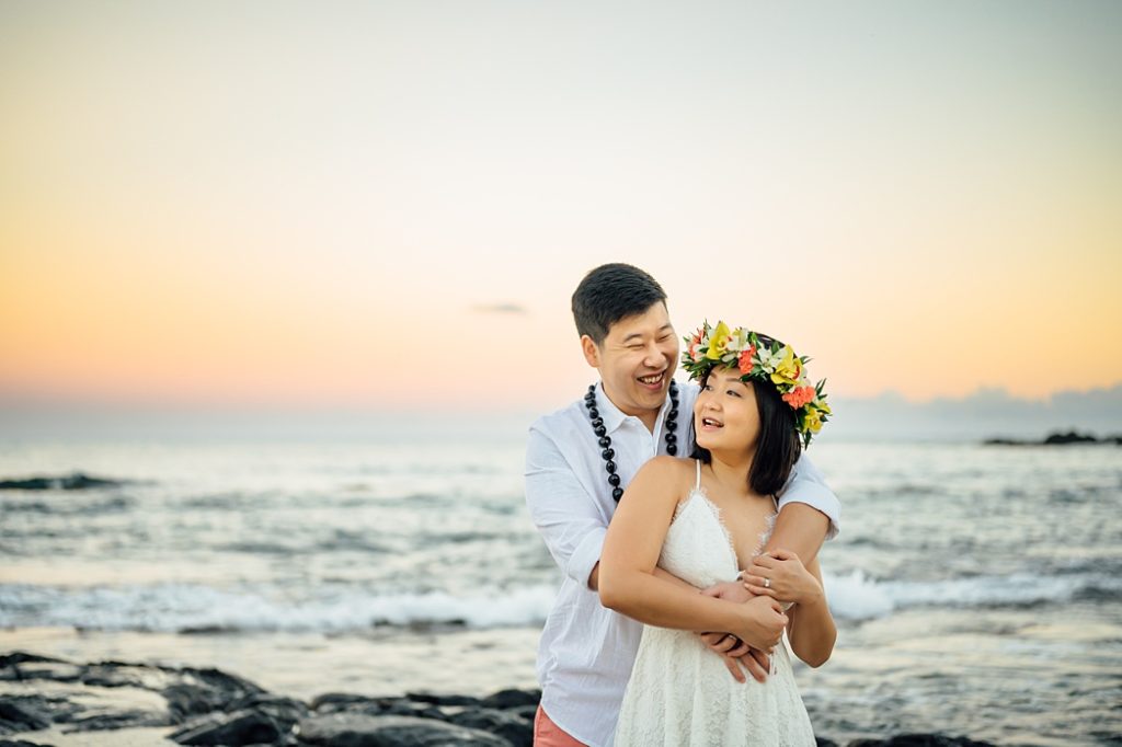 sweet engagement photo of the couple during Hawaii sunset