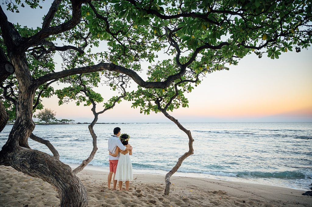 sweet couple looking at the Hawaii seas