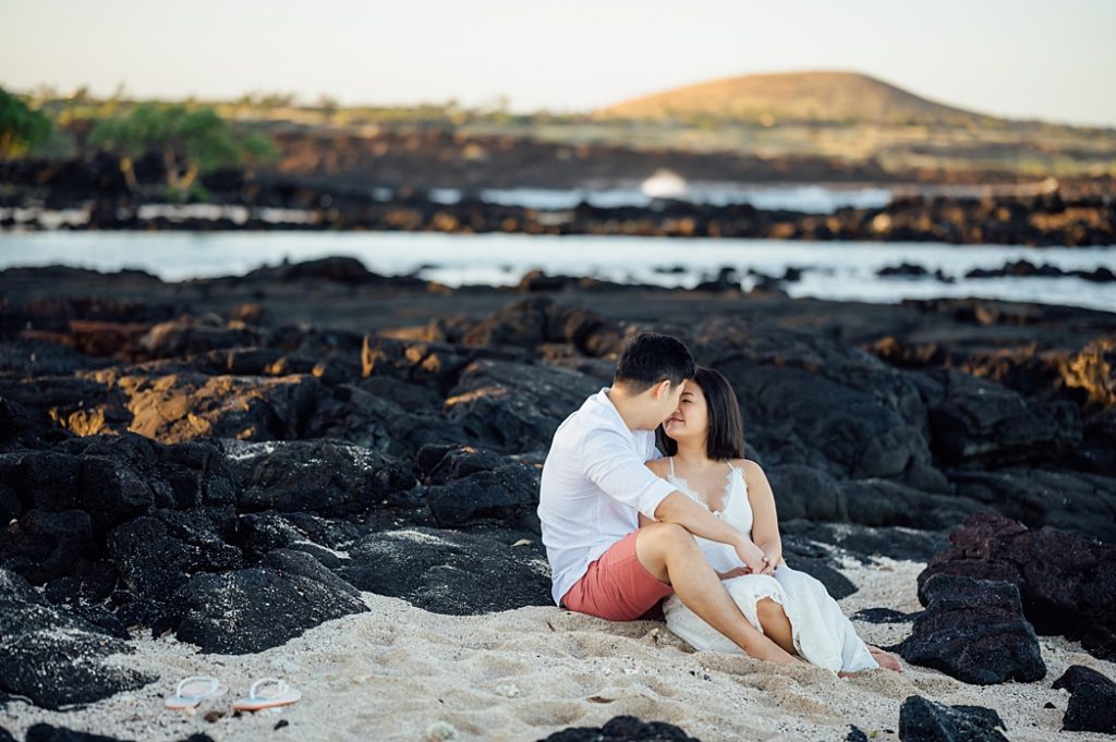 sweet engagement photo of the couple on the lava rocks