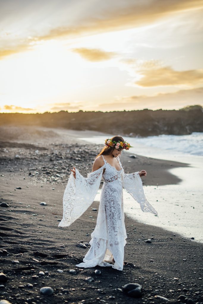 bride in her gorgeous dress on the black sand beach