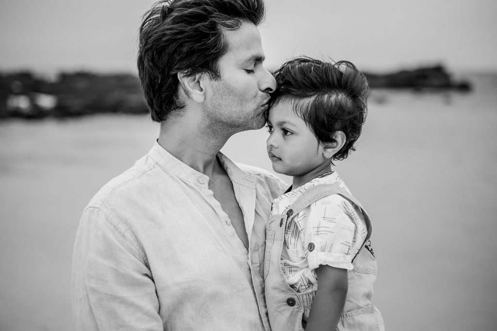dad kissing son's forehead during the photoshoot