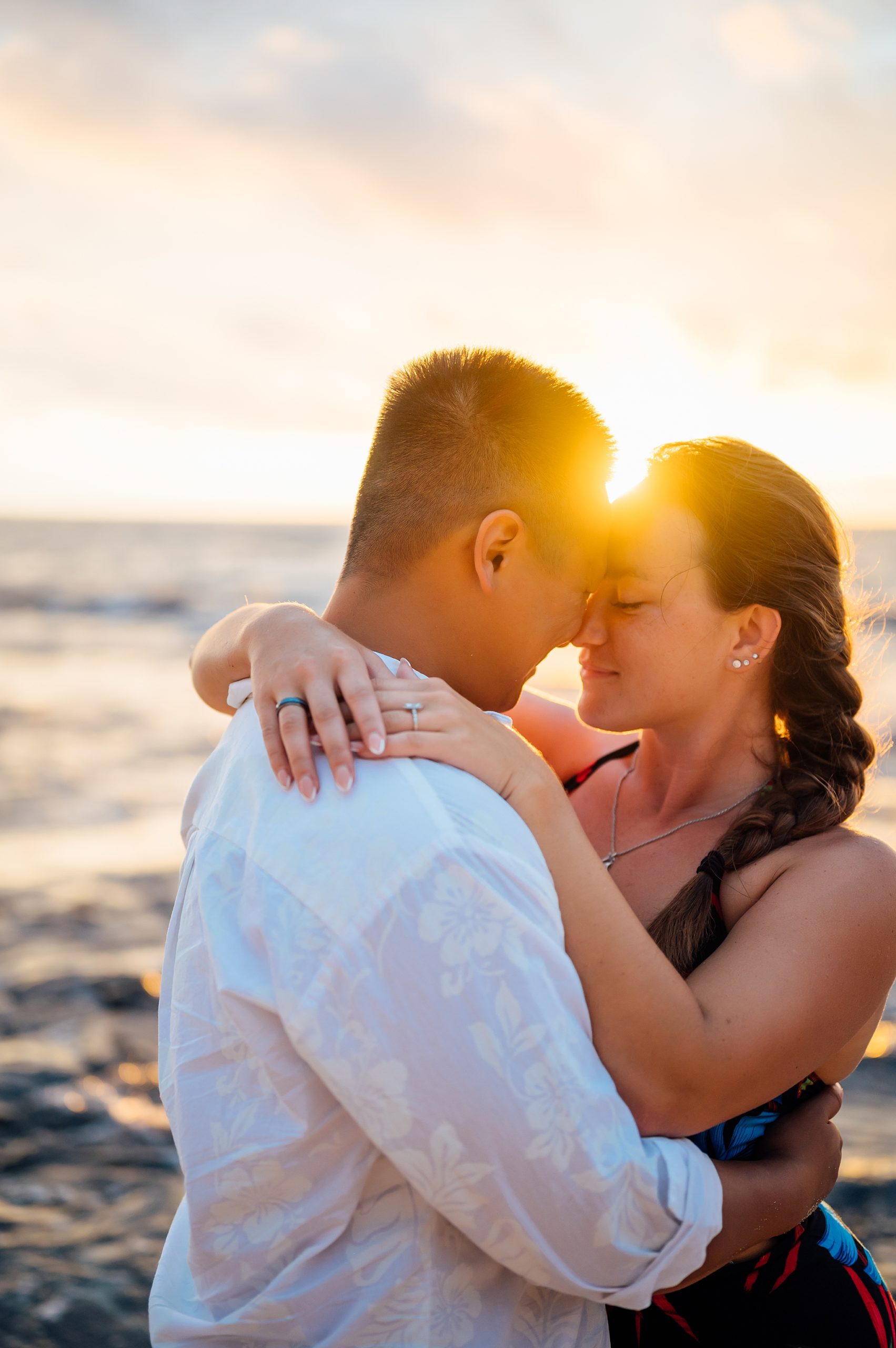 stunning sunset behind the couple during their honeymoon session