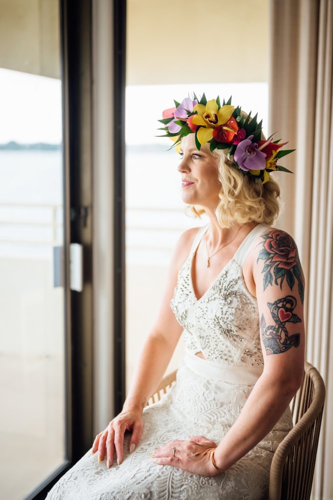 bride with her vibrant-colored wedding floral crown 