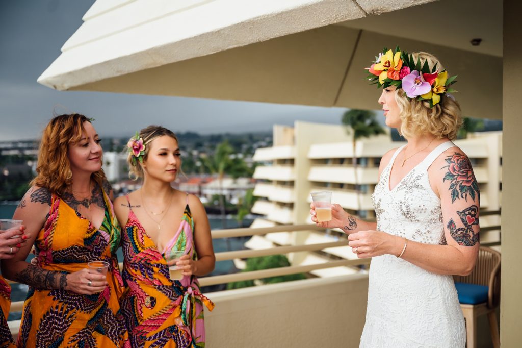 bride making a toasts with bridesmaids during her Kona wedding