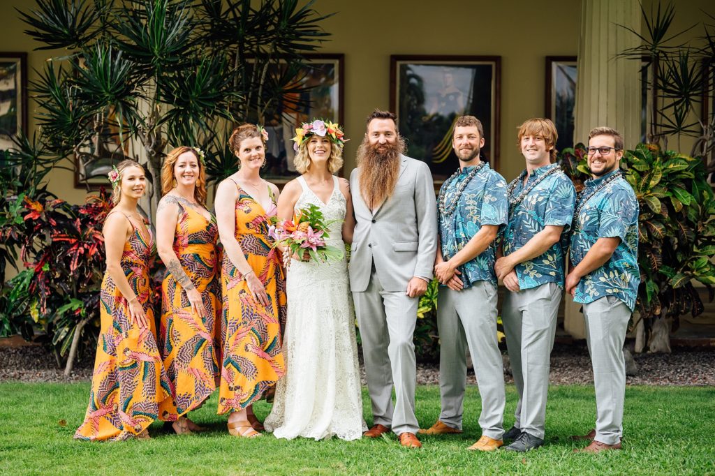 couple with their wedding party at Royal Kona Resort