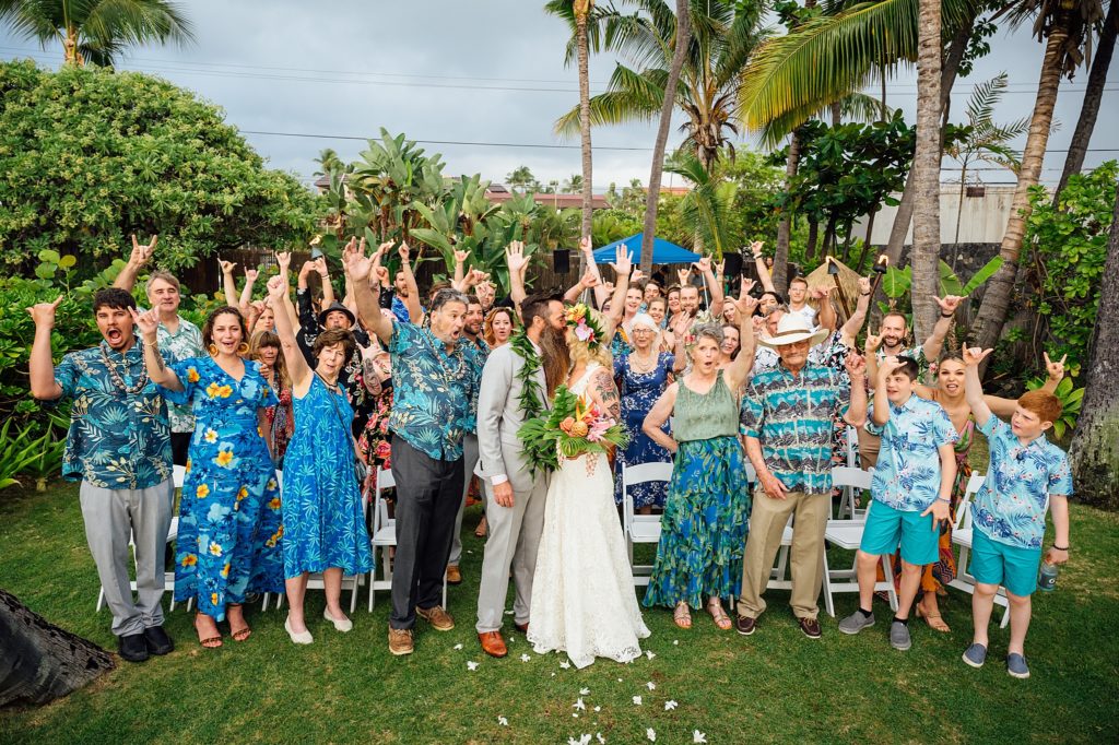 bride and groom with their happy guests at Royal Kona