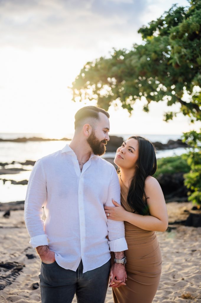 couple looking adoringly at each other at Hawaii beach