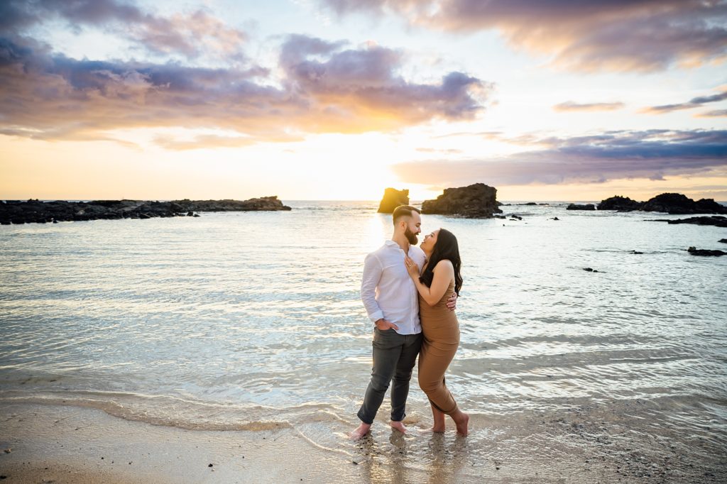 engagement photo of a couple during sunset at the beach