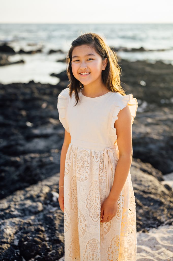 lovely young girl at the Kona beach by photographer