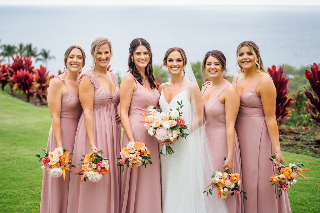 gorgeous bride with her bridesmaids during her Hawaii wedding