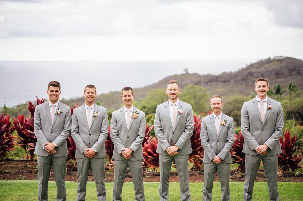 smiling groom and groomsmen by wedding photographer
