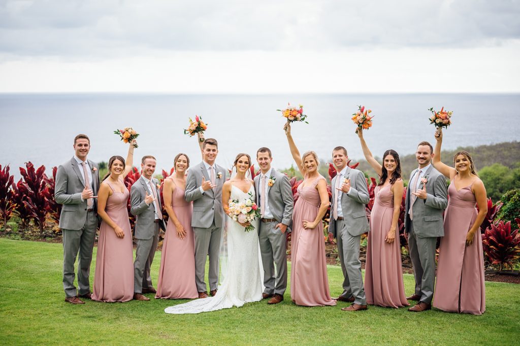 happy bride and groom with their wedding party in Hawaii